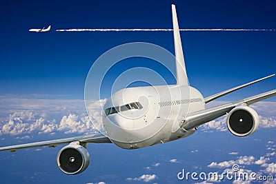 Large passenger plane in blue sky Stock Photo