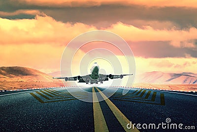 Large passenger plane take off from airport runway Stock Photo