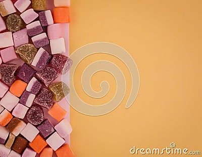 A large pile of mixed sweets on background Stock Photo
