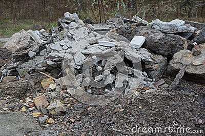 A large pile of rubbish from pieces of gray concrete Stock Photo