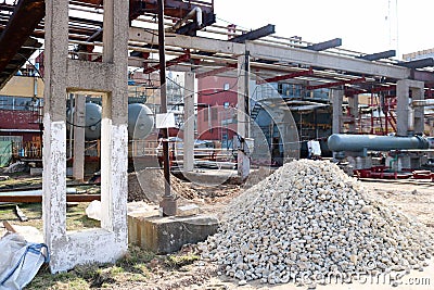 A large pile of rubble, stones on the construction site for the construction of an oil refinery at an oil refinery, a petrochemica Stock Photo