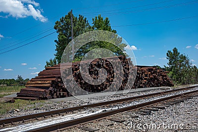 A large pile of unused and discarded railroad tiles. Stock Photo