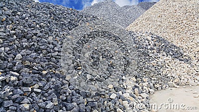 Large piles of limestone for use in lime kiln line . Limestone gravel background Stock Photo