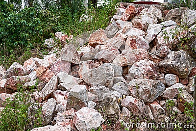 Large piles of rubble produced by blasting mountains in the wild Stock Photo