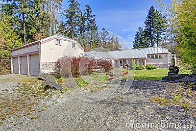 Large pink house with three car garage Stock Photo