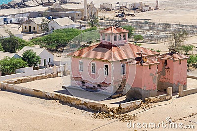 Large pink ruined mansion from Portuguese colonial times in Angola Stock Photo