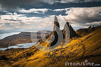 Large pinnacle of "Old Man of Storr" rocks against a cloudy sky in Scotland Stock Photo