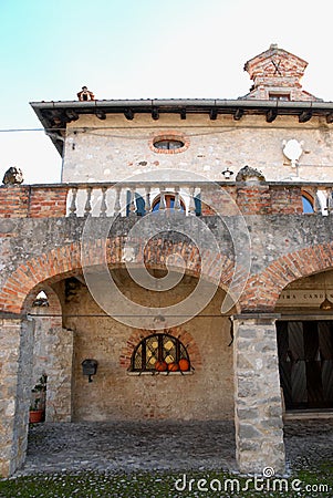 Large porch of an old building that is part of the village of Strassoldo Friuli (Italy) Stock Photo