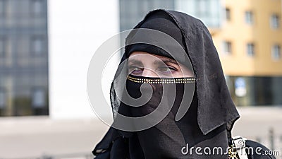 A large portrait Islamic woman in national black Stock Photo
