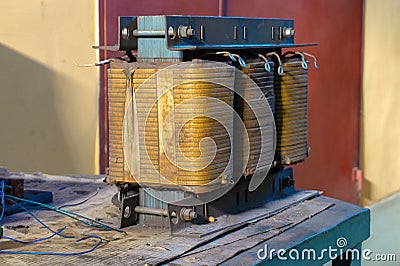 Large and powerful transformer with copper winding for repair Stock Photo