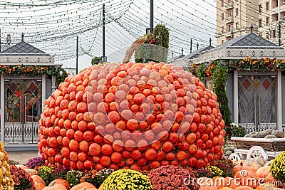 Large pumpkin collected from small orange pumpkins, decoration for the harvest festival or Halloween Stock Photo