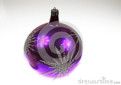 A large purple Christmas bauble on an isolated white background Stock Photo