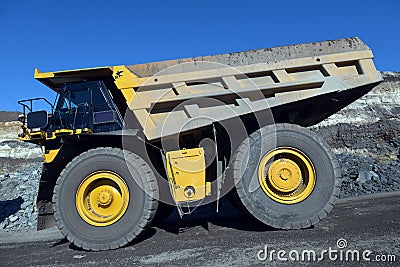 Large quarry dump truck. Loading the rock in the dumper. Loading Stock Photo