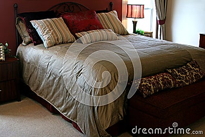 Large queen sized bed Stock Photo