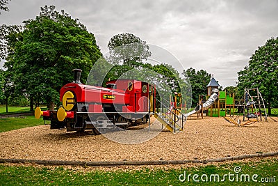 Large red train in Seaton park outdoor children playground, Aberdeen, Scotland Editorial Stock Photo