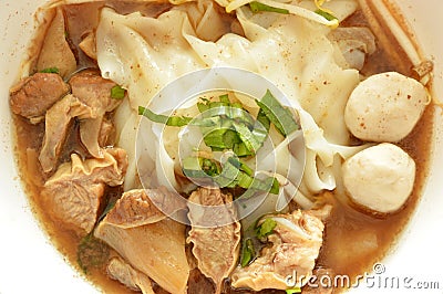 Large rice noodle with braised pork in herb brown soup Stock Photo