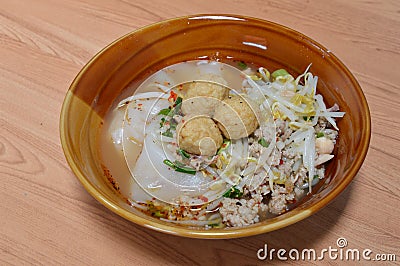 Large rice noodle topping shrimp ball in soup Stock Photo