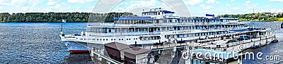 Russia, Uglich, July 2020. Panorama of the Volga River and a passenger ship at the pier. Editorial Stock Photo