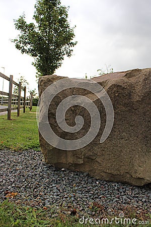 Large rock feature on public pathway UK Stock Photo
