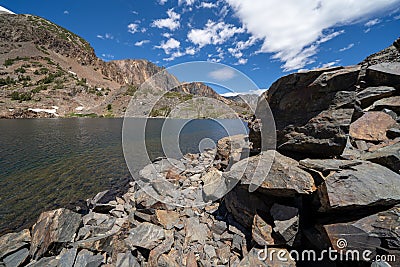 Large rocks and loose scree along Lake Helen along the 20 Lakes Basin and Lundy Canyon in California Mono County Stock Photo