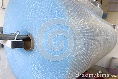 Large roll of industrial packaging film. Soft bubble film for packaging during transportation at the enterprise Stock Photo
