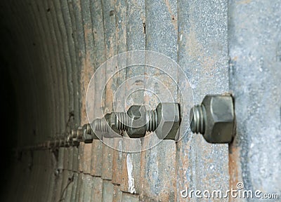 Large screws joining metal water conduction parts Stock Photo