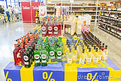 A large selection of various wines are on the shelf in a large supermarket. Editorial Stock Photo