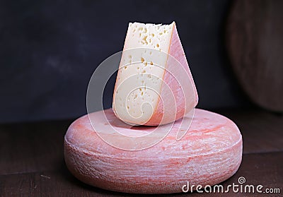 Sliced semi-solid milk cheese on the table Stock Photo