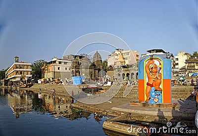 Large size statue of Hindu God Hanuman on the bank of river Godavari at Nashik Editorial Stock Photo