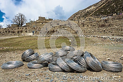 Large skeins of aluminum wire near the mountain village, Nepal. Editorial Stock Photo