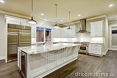 Large, spacious kitchen design with white kitchen cabinets Stock Photo