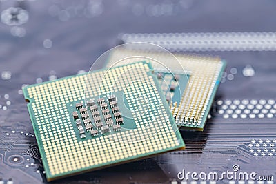 A large square microprocessor for computers lies on motherboard Stock Photo