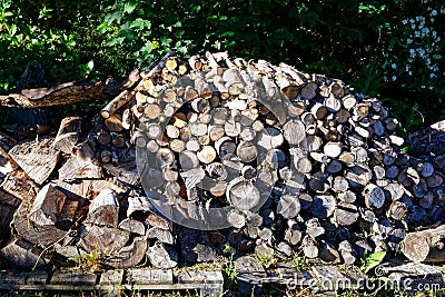 A large stack of firewood ready for the cold months Stock Photo