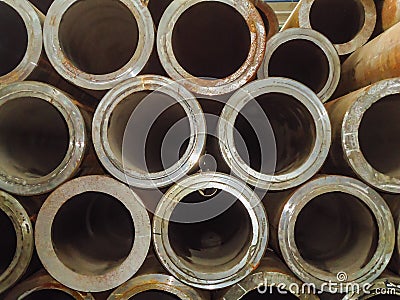 Large stack of thick-walled steel pipes for building structures Stock Photo