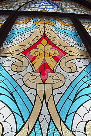 large stained glass window with colored patterned glass Stock Photo