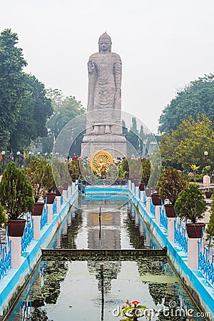 Large statue of standing Buddha in WAT THAI Temple, Sarnath city near Varanasi, India Stock Photo