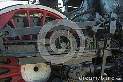 Large steel wheels of old steam locomotive red with white outline Stock Photo