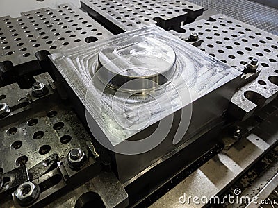 large steel workpiece after cnc surface milling on table of milling machine, industrial cnc technology backdrop Stock Photo