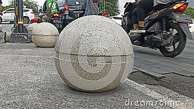 large stone ball on the sidewalk in Titik Nol Kilometer area of ??Yogyakarta City Stock Photo