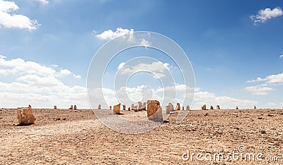 Large stone blocks chaotically standing in a park of stones in the Judean Desert near the city of Mitzpe Ramon in Israel Stock Photo