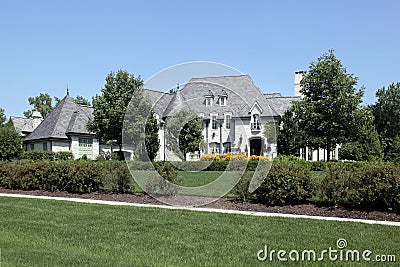 Large stone and cedar home Stock Photo