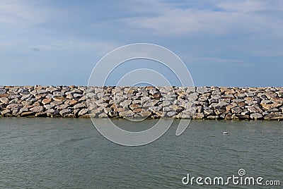 Large stones Was prepared in place of the sandy beach for the wave walls Stock Photo