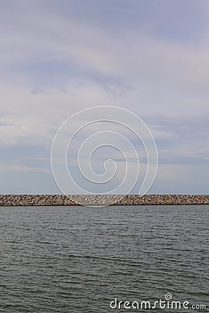 Large stones Was prepared in place of the sandy beach for the wave walls Stock Photo