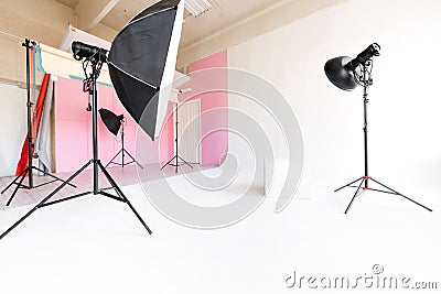 Large studio space white cyclorama and natural light from large windows. lighting equipment and flash Stock Photo