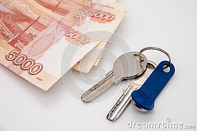 A large sum of Russian money and the keys are on the plan of the apartment. Buying a house for cash Stock Photo