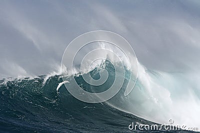 Large surf wave with barrel and wind. Stock Photo
