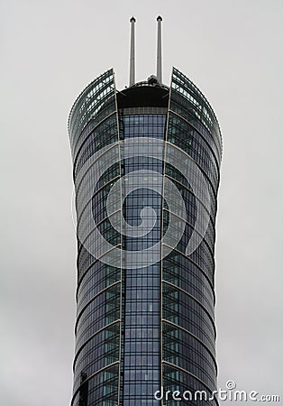 a large tall modern tower spire tower with a sky background Stock Photo