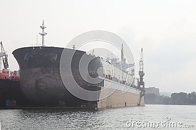 A large tanker ship is being repair in shipyard Poland Stock Photo