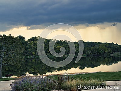 Large thunderstorm forming at Lake Olathe over the forest in Olathe city, Kansas Stock Photo