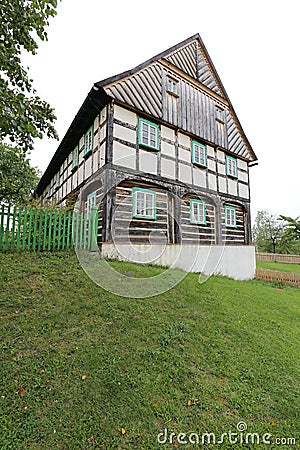 Large timbered house on the steep hill Stock Photo